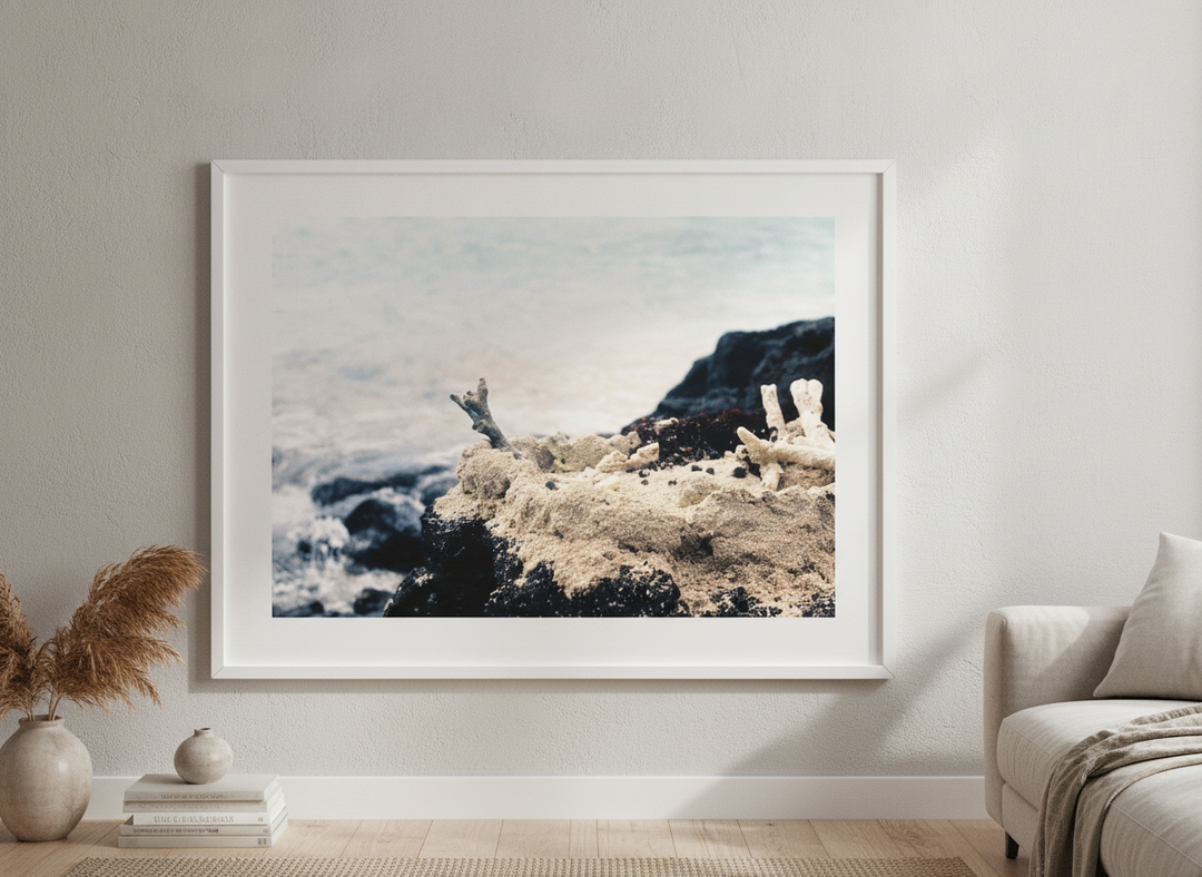 Modern wall art styled above a sofa in a neutral living room