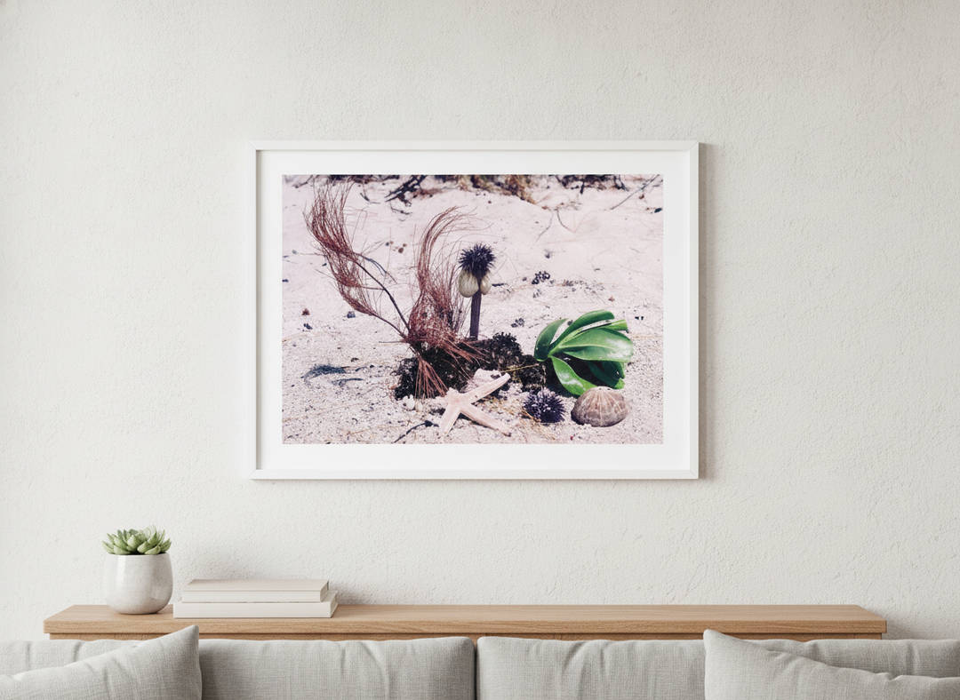 Modern wall art styled above a sofa in a neutral living room