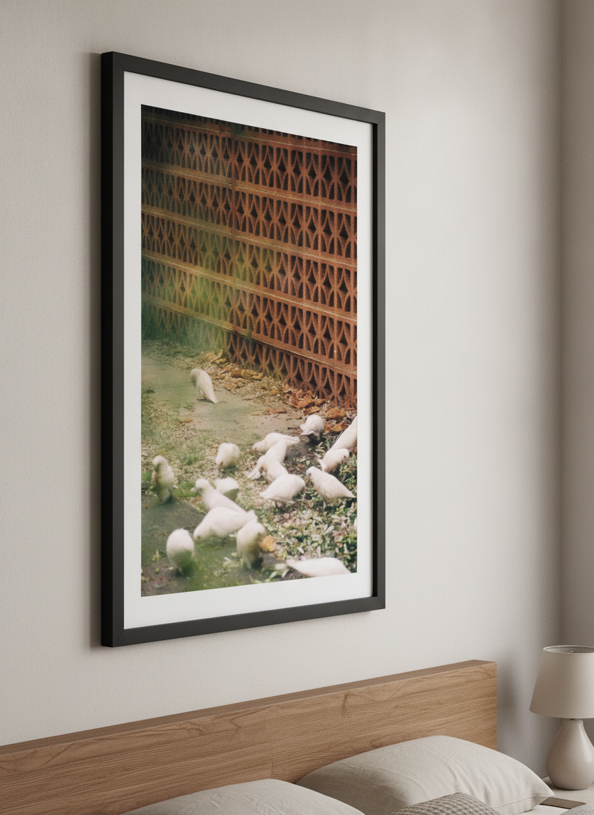 Minimalist artwork displayed in a calm, light-filled bedroom interior