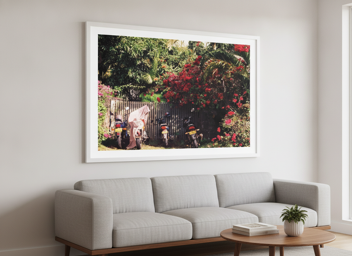 Modern wall art styled above a sofa in a neutral living room