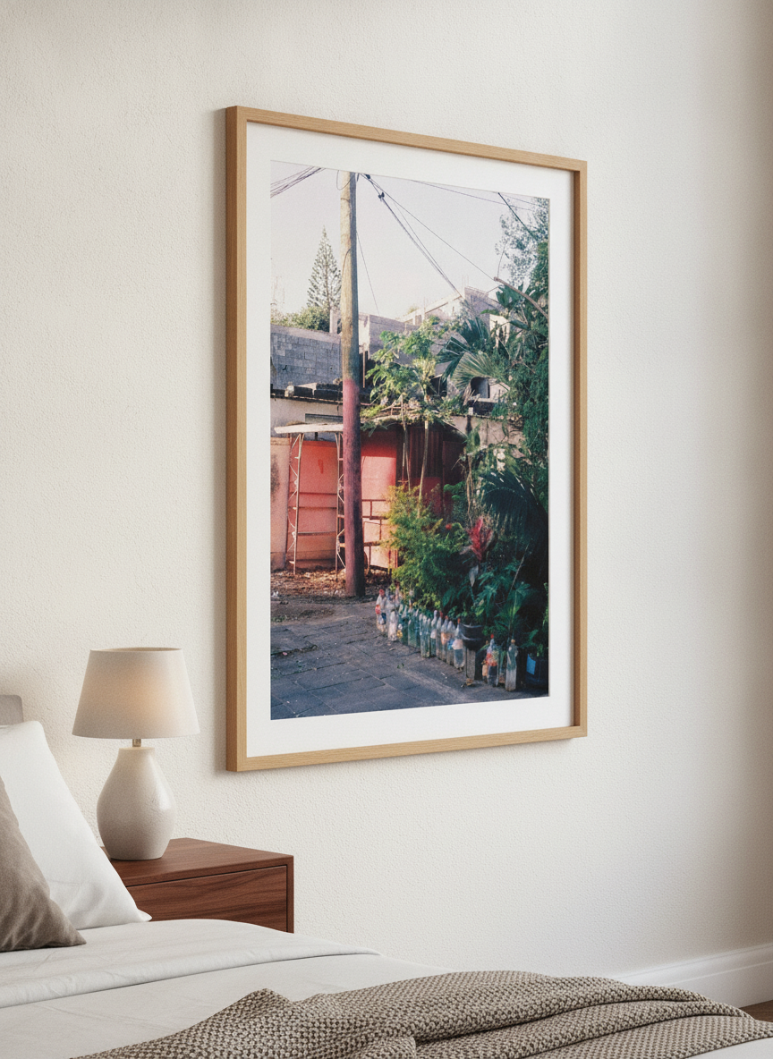 Minimalist artwork displayed in a calm, light-filled bedroom interior