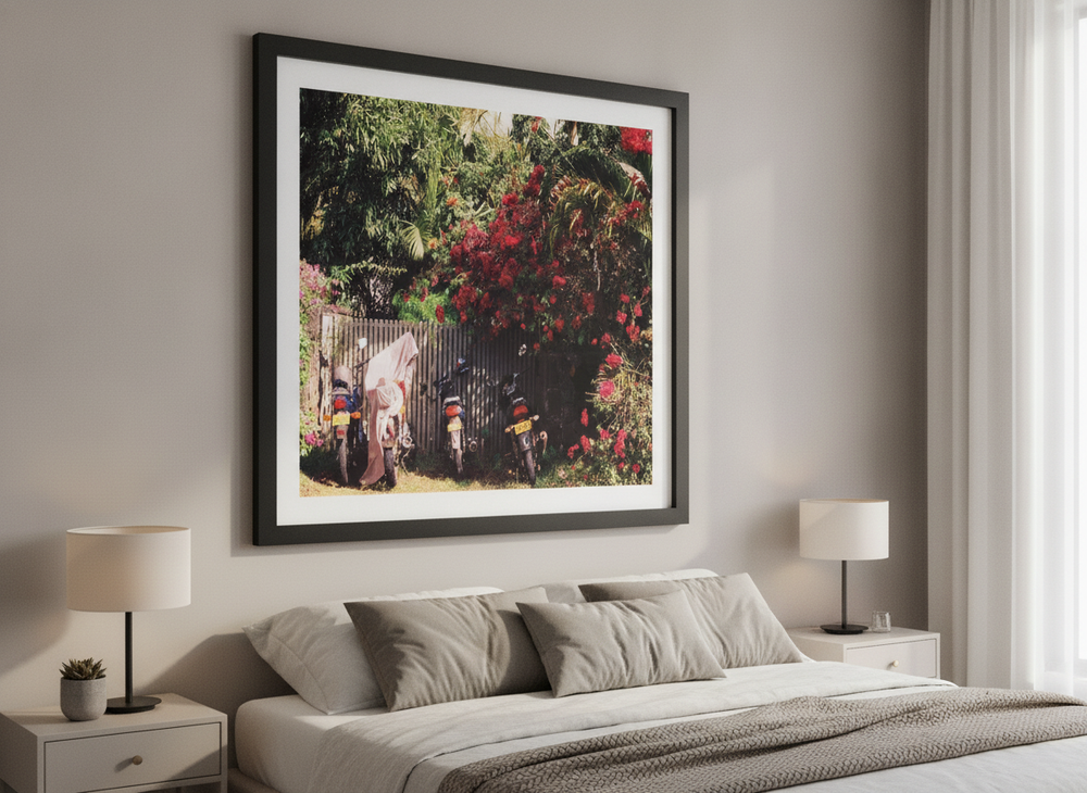 Minimalist artwork displayed in a calm, light-filled bedroom interior