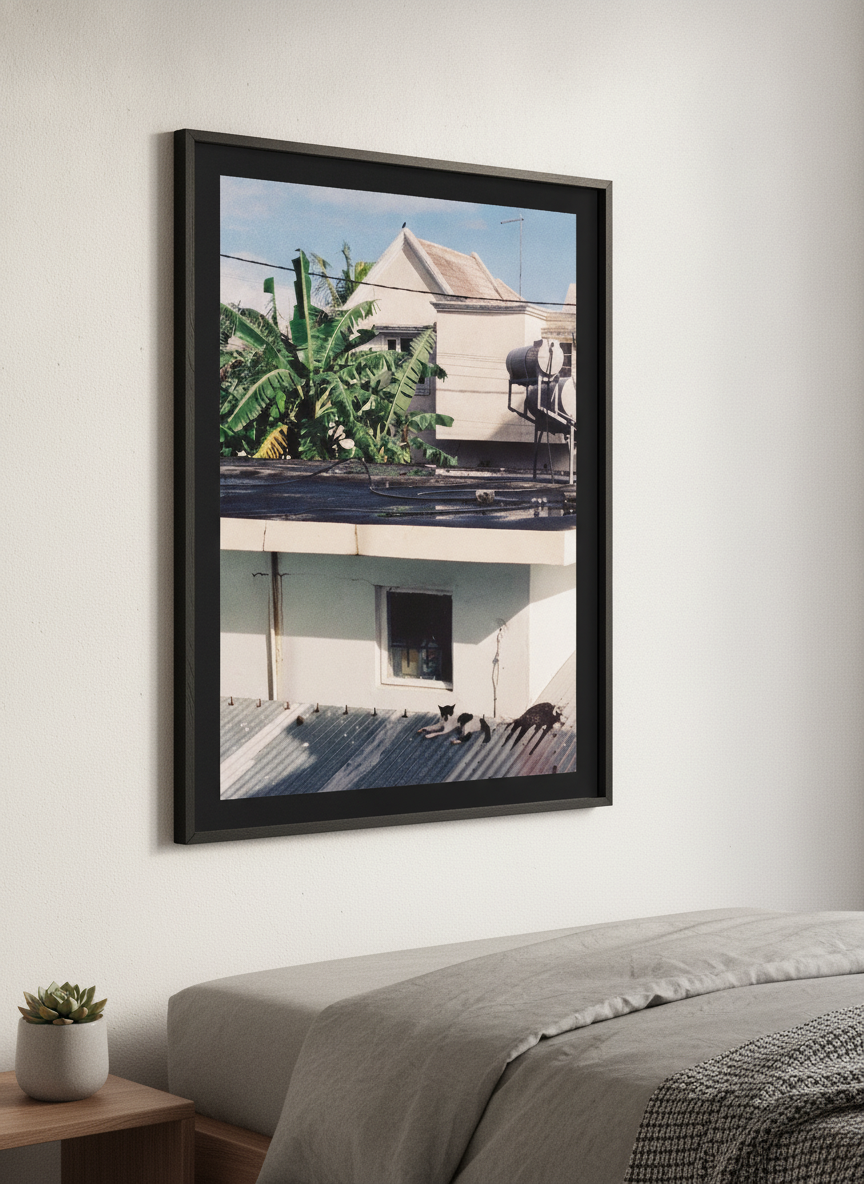 Minimalist artwork displayed in a calm, light-filled bedroom interior