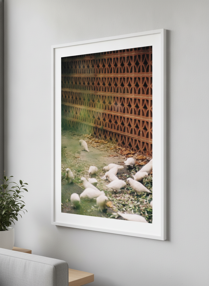 Modern wall art styled above a sofa in a neutral living room