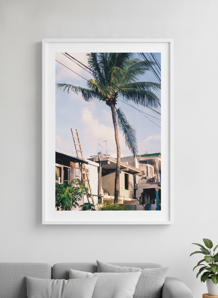 Modern wall art styled above a sofa in a neutral living room