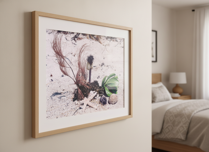 Minimalist artwork displayed in a calm, light-filled bedroom interior