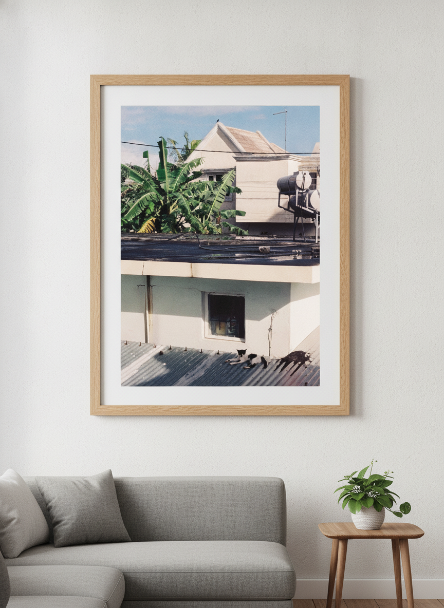 Modern wall art styled above a sofa in a neutral living room