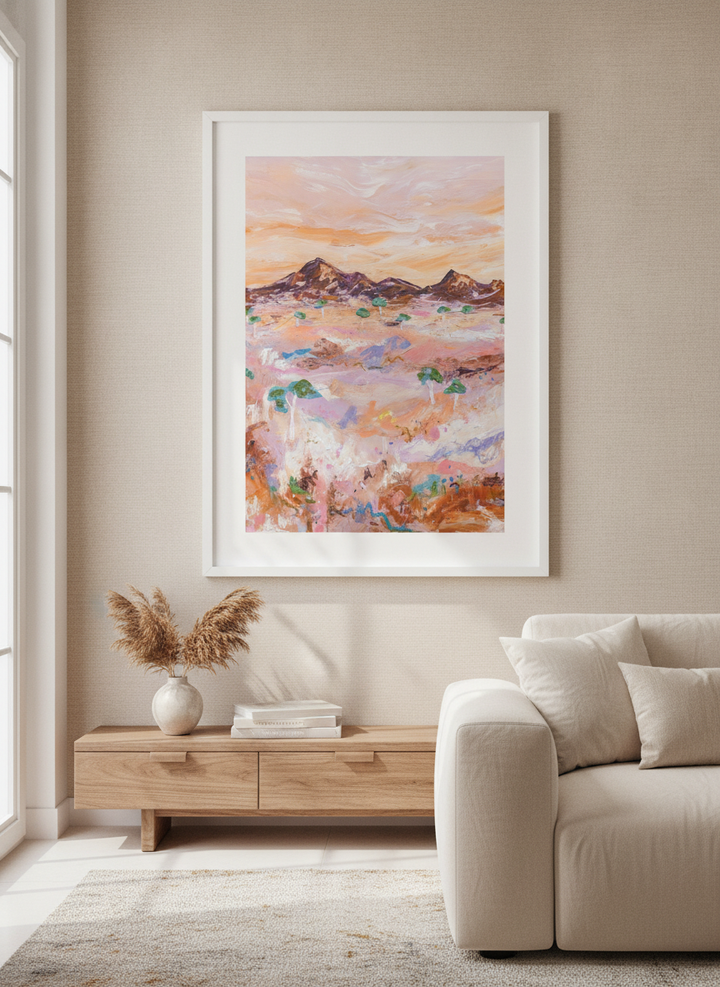 Modern wall art styled above a sofa in a neutral living room