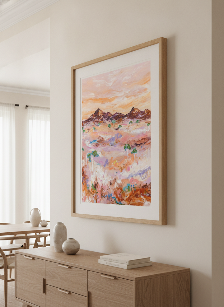 Wall art styled above a dining table in a contemporary home