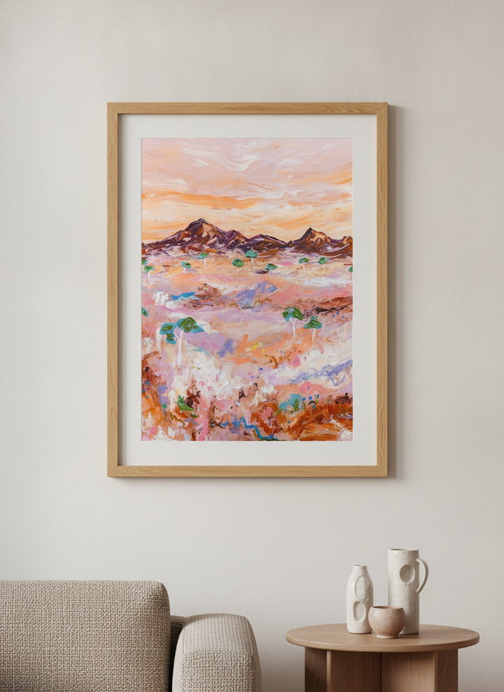 Modern wall art styled above a sofa in a neutral living room