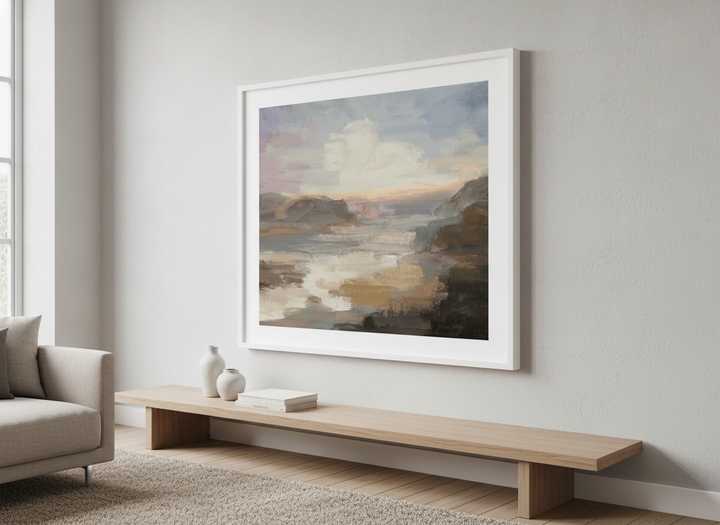 Modern wall art styled above a sofa in a neutral living room