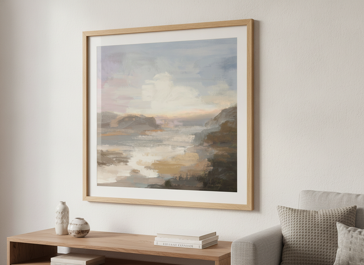 Modern wall art styled above a sofa in a neutral living room