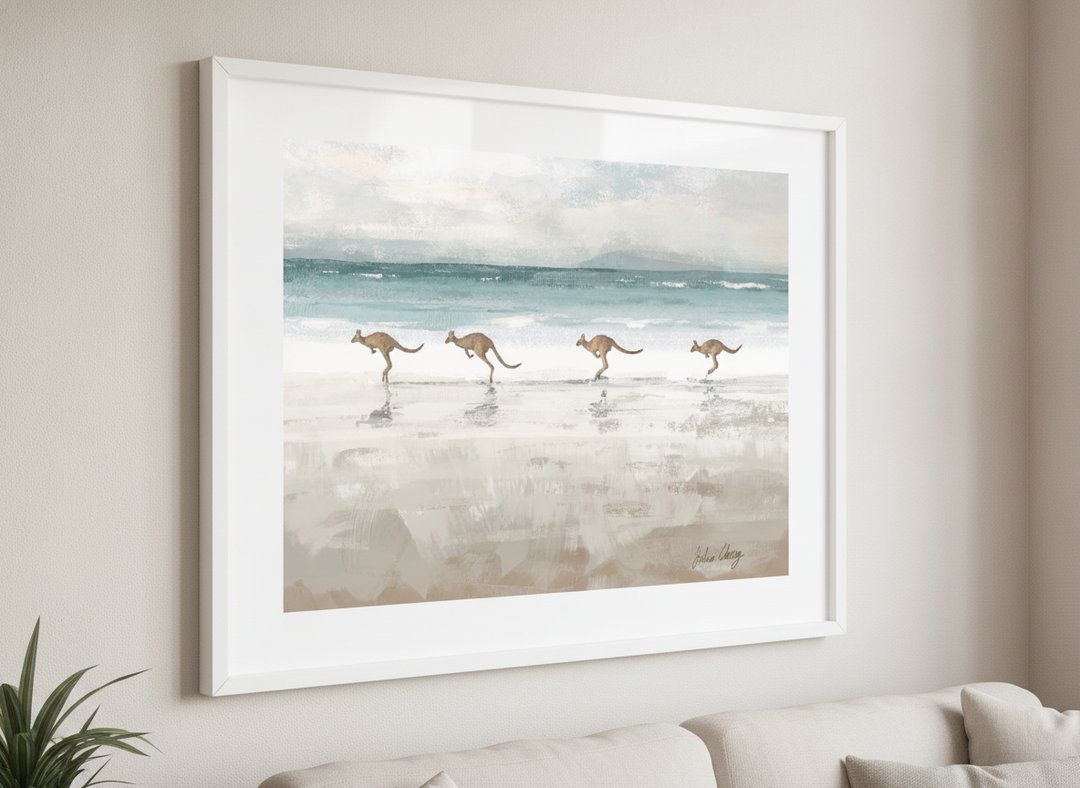 Modern wall art styled above a sofa in a neutral living room