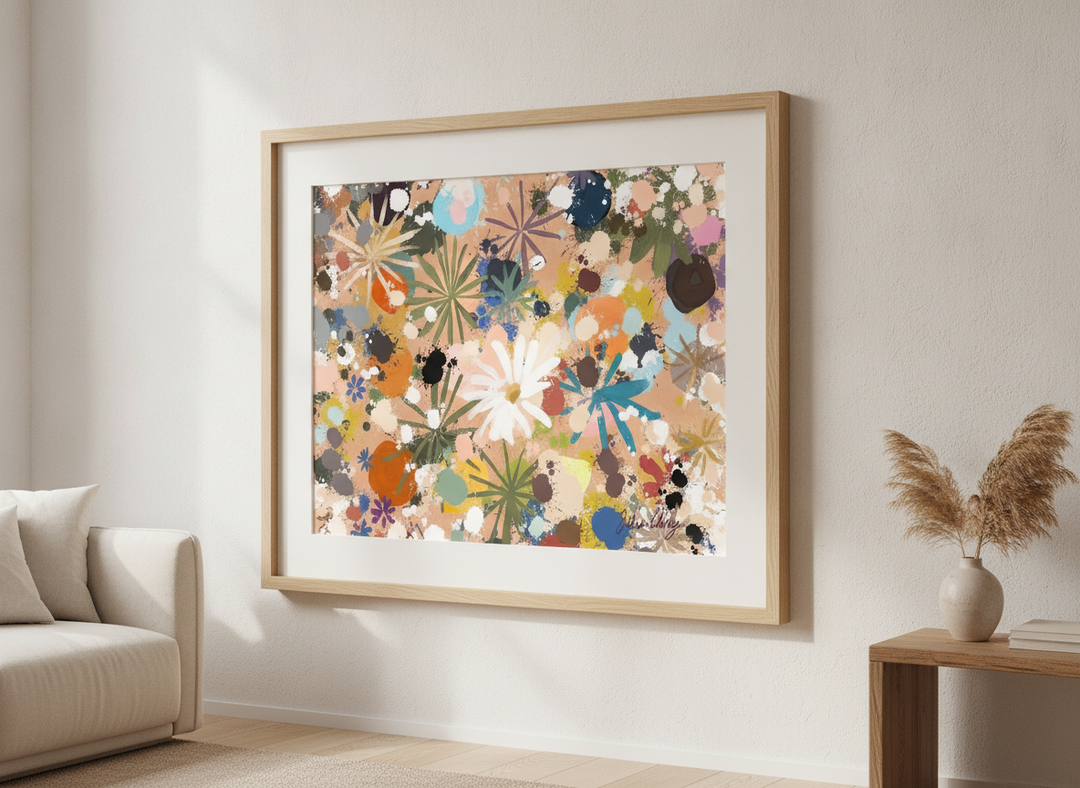 Modern wall art styled above a sofa in a neutral living room