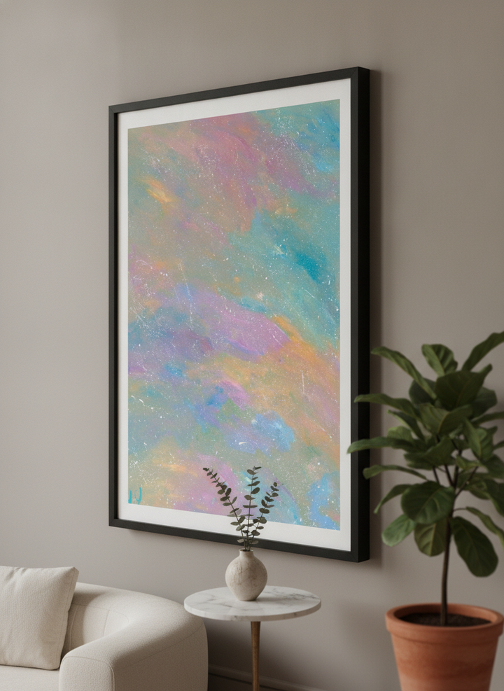 Modern wall art styled above a sofa in a neutral living room
