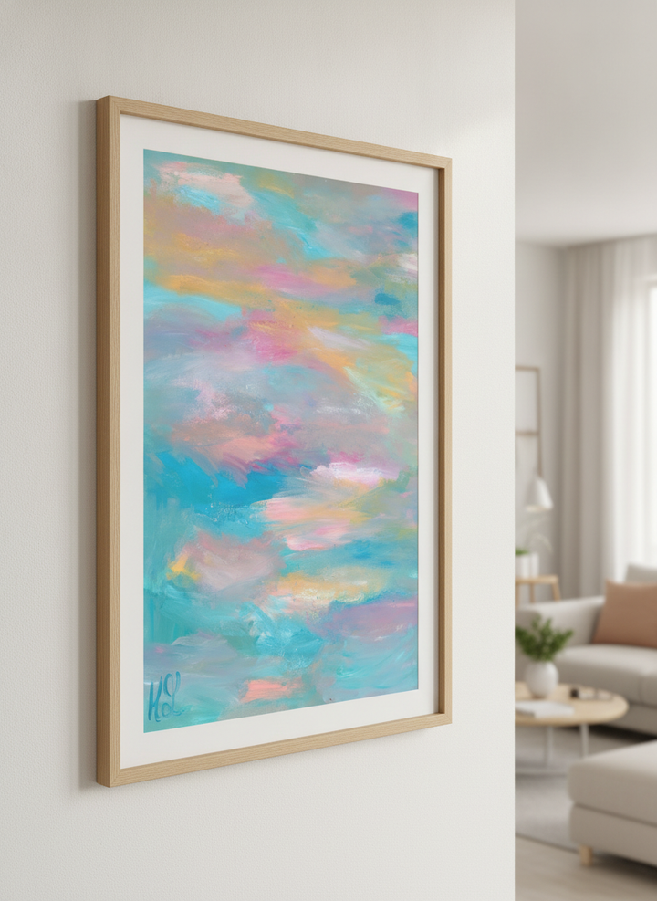 Modern wall art styled above a sofa in a neutral living room