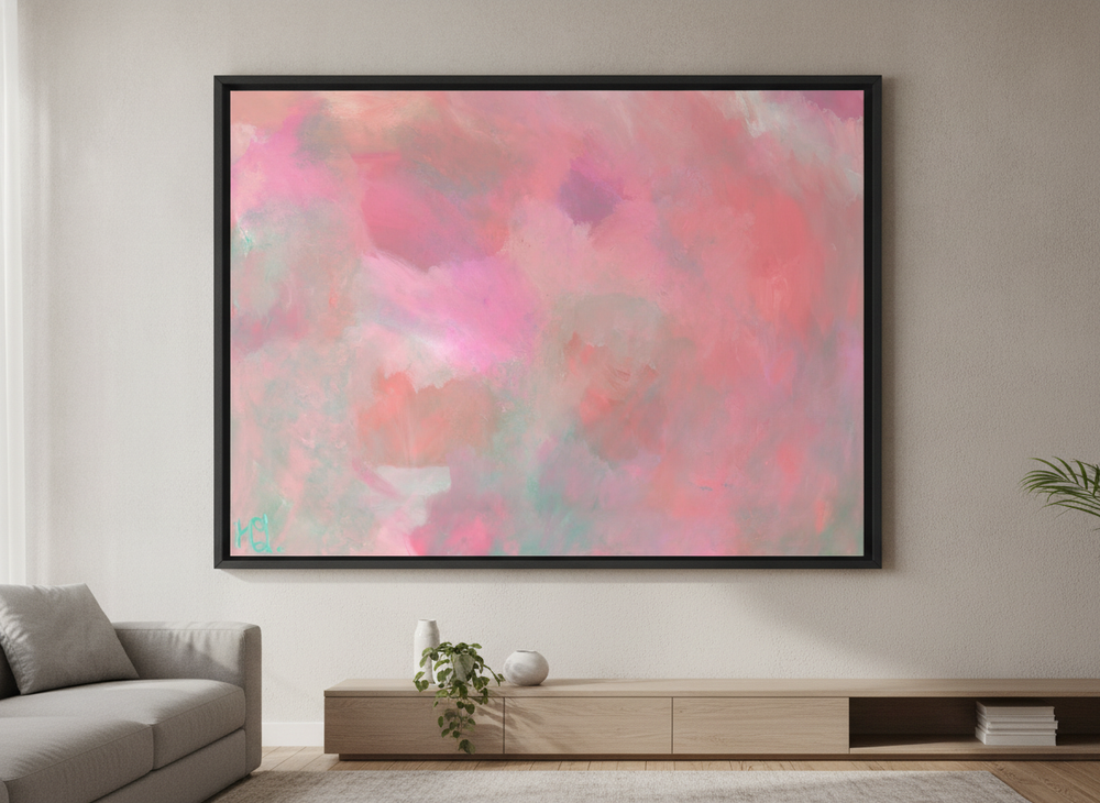 Modern wall art styled above a sofa in a neutral living room