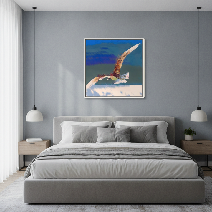 Canvas wall art with a white surround styled in a calm, light-filled bedroom