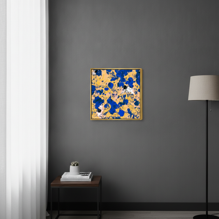 Canvas wall art with a gold leaf surround styled in a bright modern office