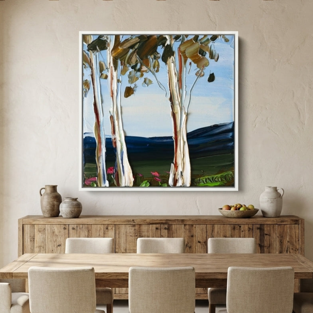 Oversized statement canvas wall art with a white surround styled in a contemporary dining room
