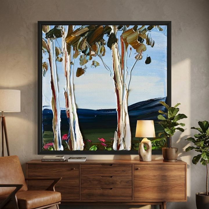 Canvas wall art with a black surround styled in a bright modern office