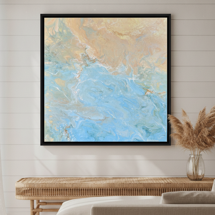Oversized statement canvas wall art with a black surround styled in a sunny coastal beach house