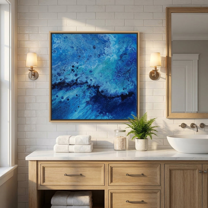 Canvas wall art with a natural timber surround styled in a clean minimalist bathroom