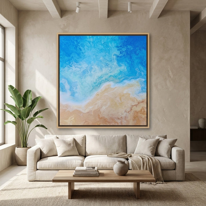 Oversized statement canvas wall art with a natural timber surround styled in a neutral living room
