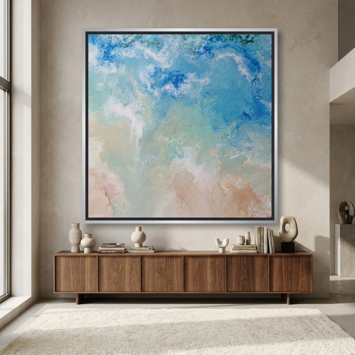 Oversized statement canvas wall art with a silver leaf surround styled in a luxe interior