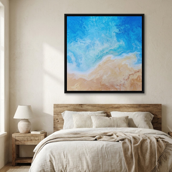 Canvas wall art with a black surround styled in a calm, light-filled bedroom
