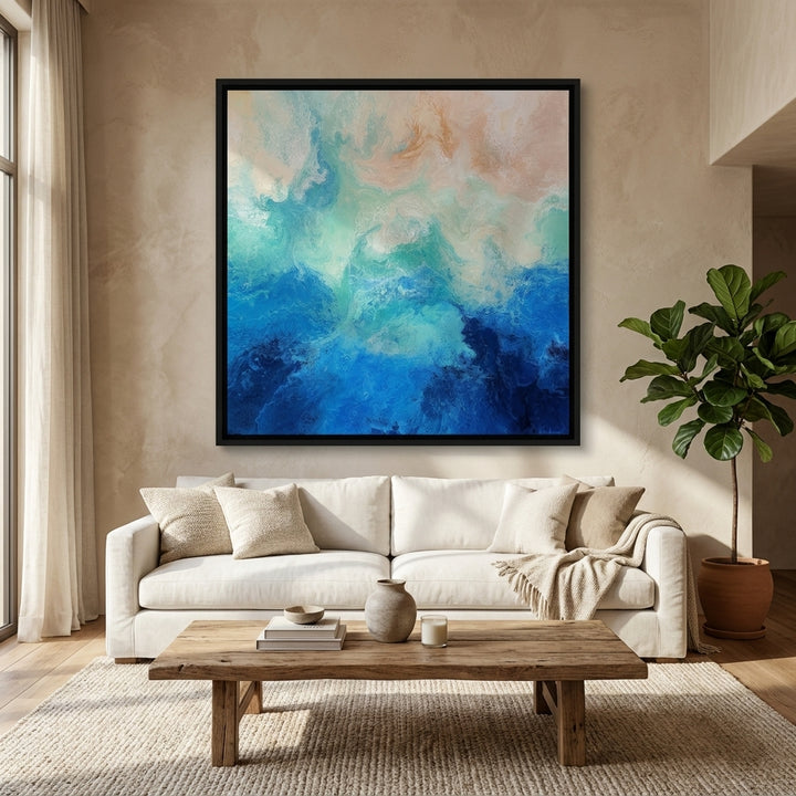 Oversized statement canvas wall art with a black surround styled in a neutral living room