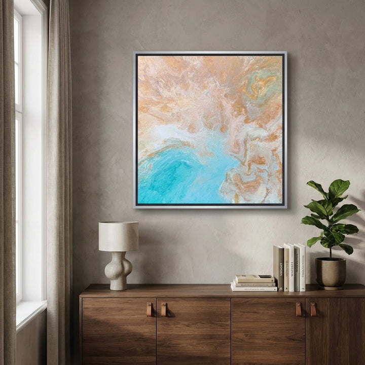 Canvas wall art with a silver leaf surround styled in a bright modern office