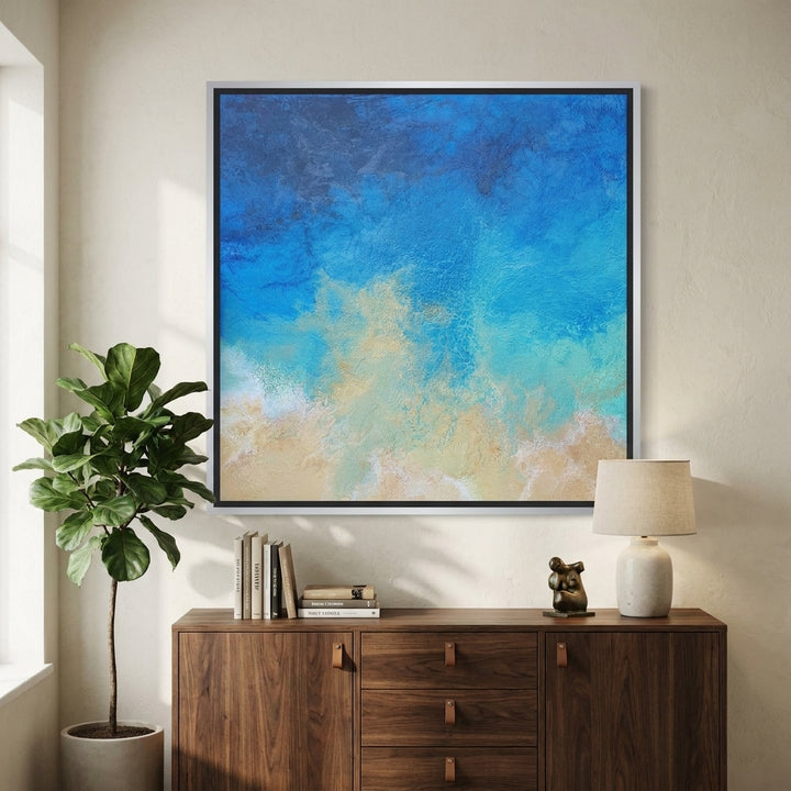 Canvas wall art with a silver leaf surround styled in a bright modern office