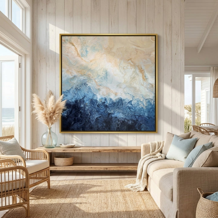 Oversized statement canvas wall art with a gold leaf surround styled in a sunny coastal beach house