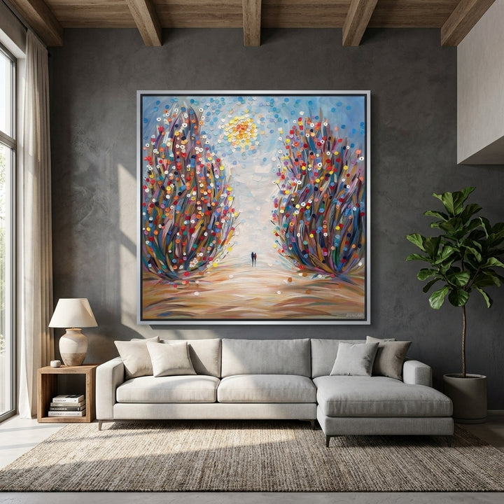 Oversized statement canvas wall art with a silver leaf surround styled in a neutral living room