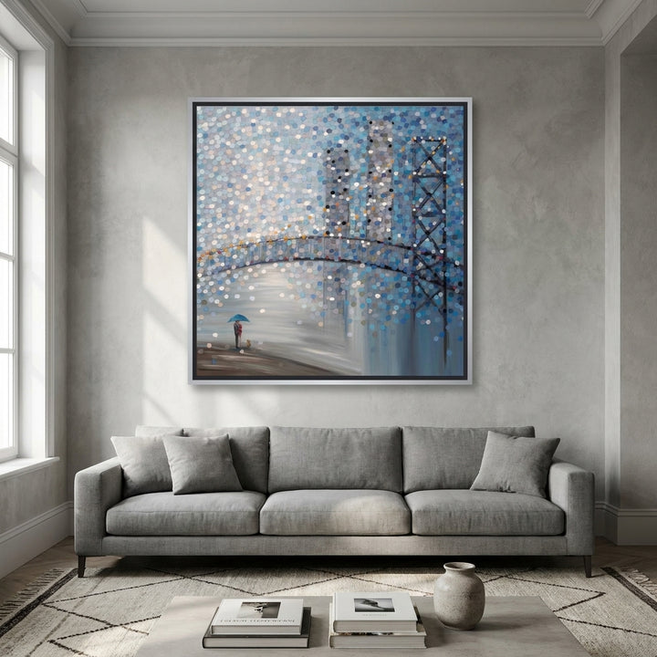 Oversized statement canvas wall art with a silver leaf surround styled in a neutral living room
