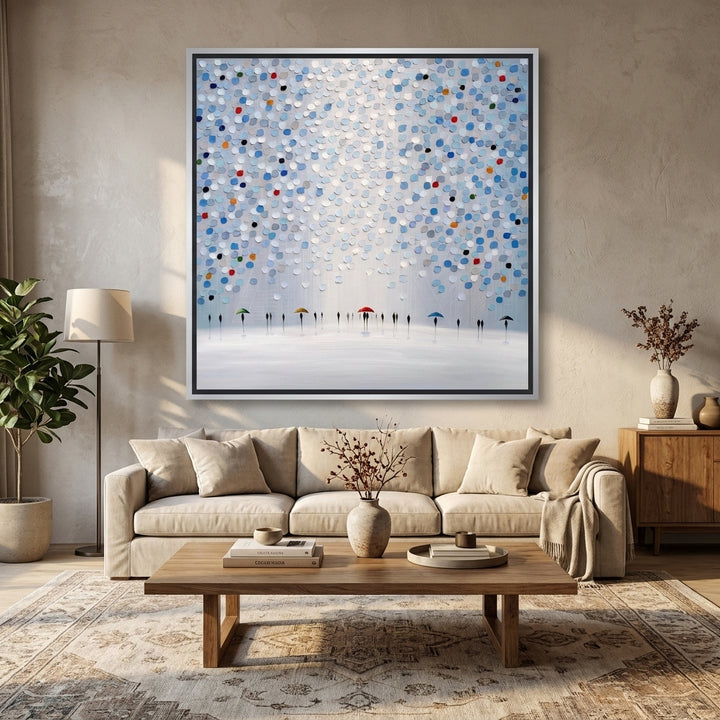 Oversized statement canvas wall art with a silver leaf surround styled in a neutral living room