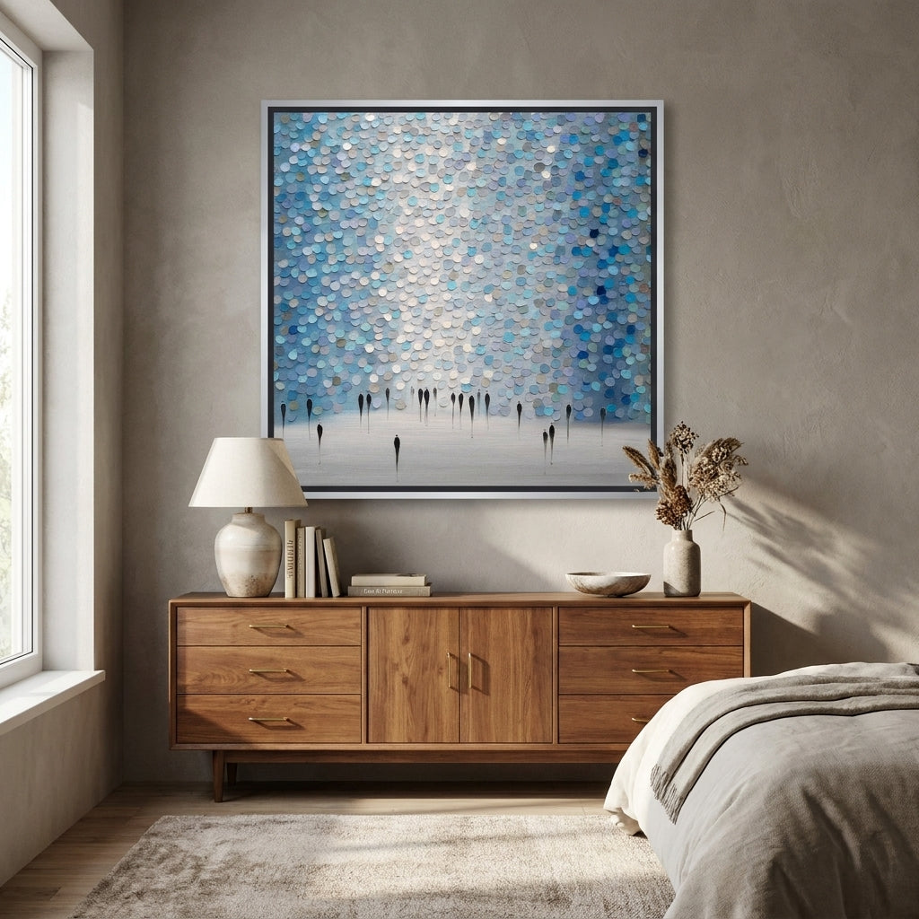Canvas wall art with a silver leaf surround styled in a calm, light-filled bedroom