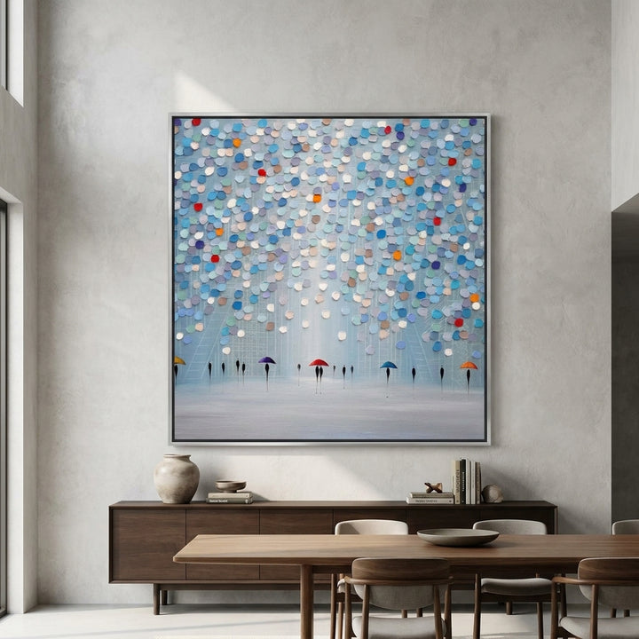 Oversized statement canvas wall art with a silver leaf surround styled in a contemporary dining room