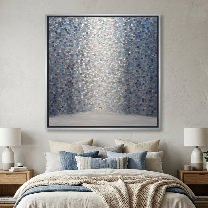 Canvas wall art with a silver leaf surround styled in a calm, light-filled bedroom