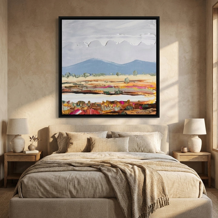 Canvas wall art with a black surround styled in a calm, light-filled bedroom