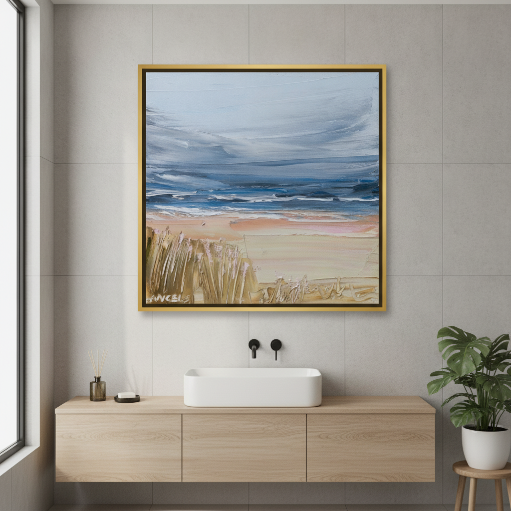 Canvas wall art with a gold leaf surround styled in a clean minimalist bathroom
