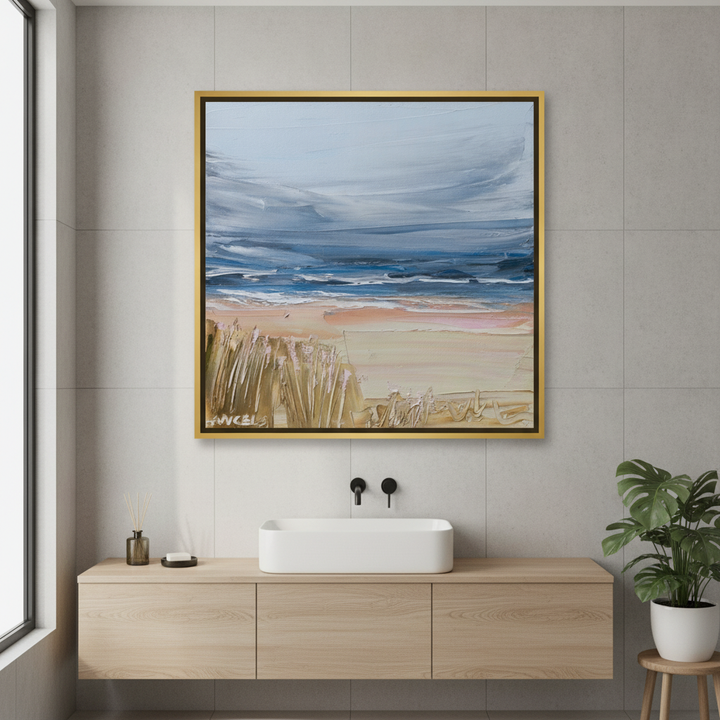 Canvas wall art with a gold leaf surround styled in a clean minimalist bathroom