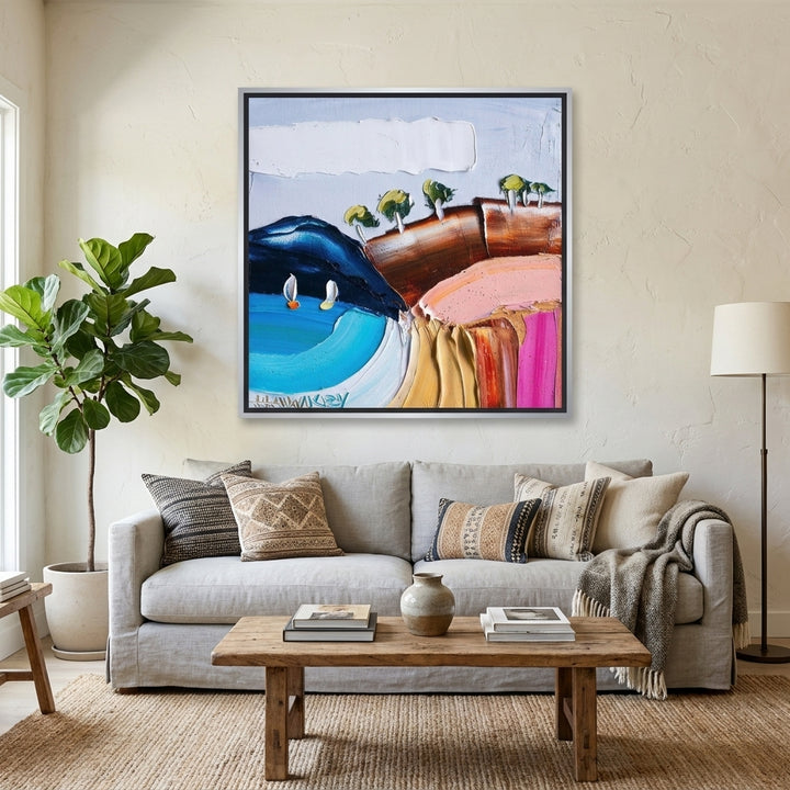 Canvas wall art with a silver leaf surround styled in a neutral living room