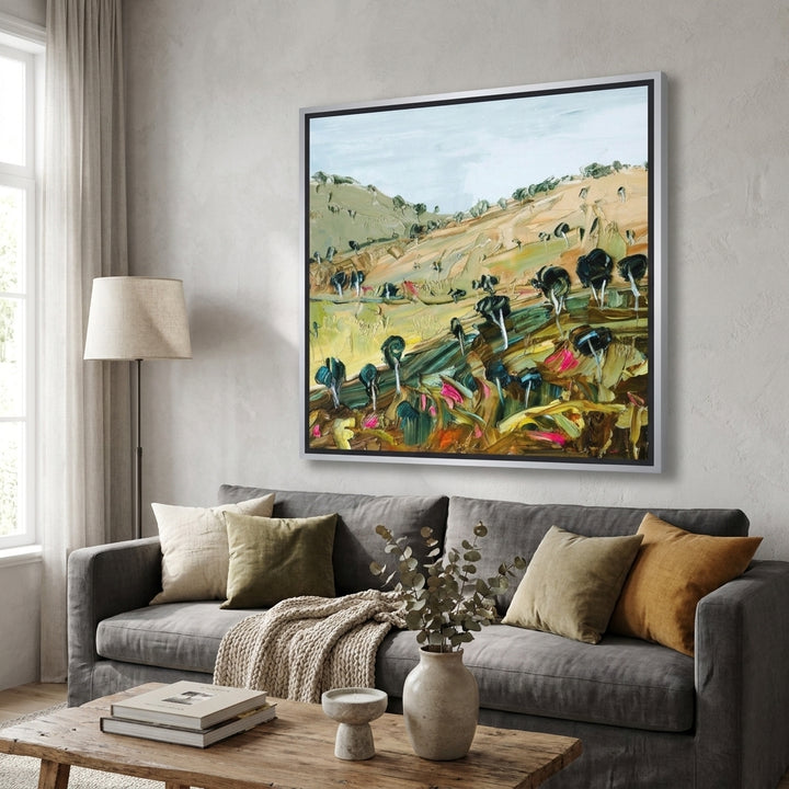 Canvas wall art with a silver leaf surround styled in a neutral living room