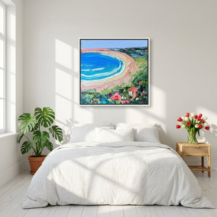 Canvas wall art with a white surround styled on the wall in a bright Scandinavian bedroom