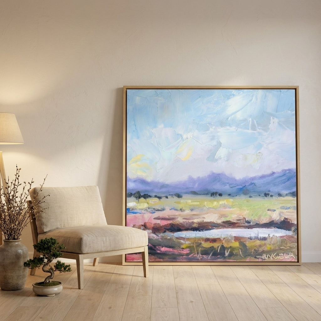 Oversized statement canvas wall art with a natural timber surround leaning against the wall in a warm Japandi bedroom