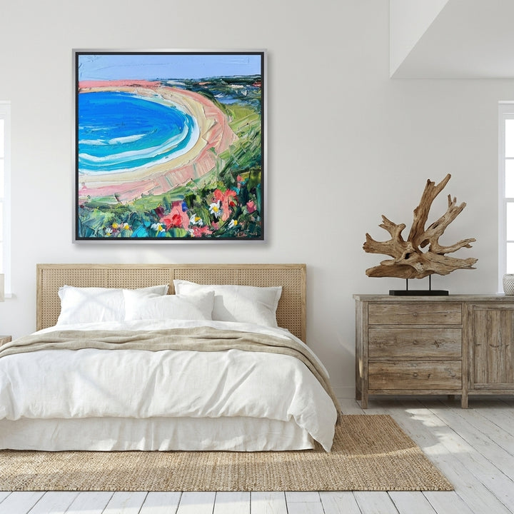 Oversized statement canvas wall art with a silver leaf surround styled on the wall in a coastal bedroom