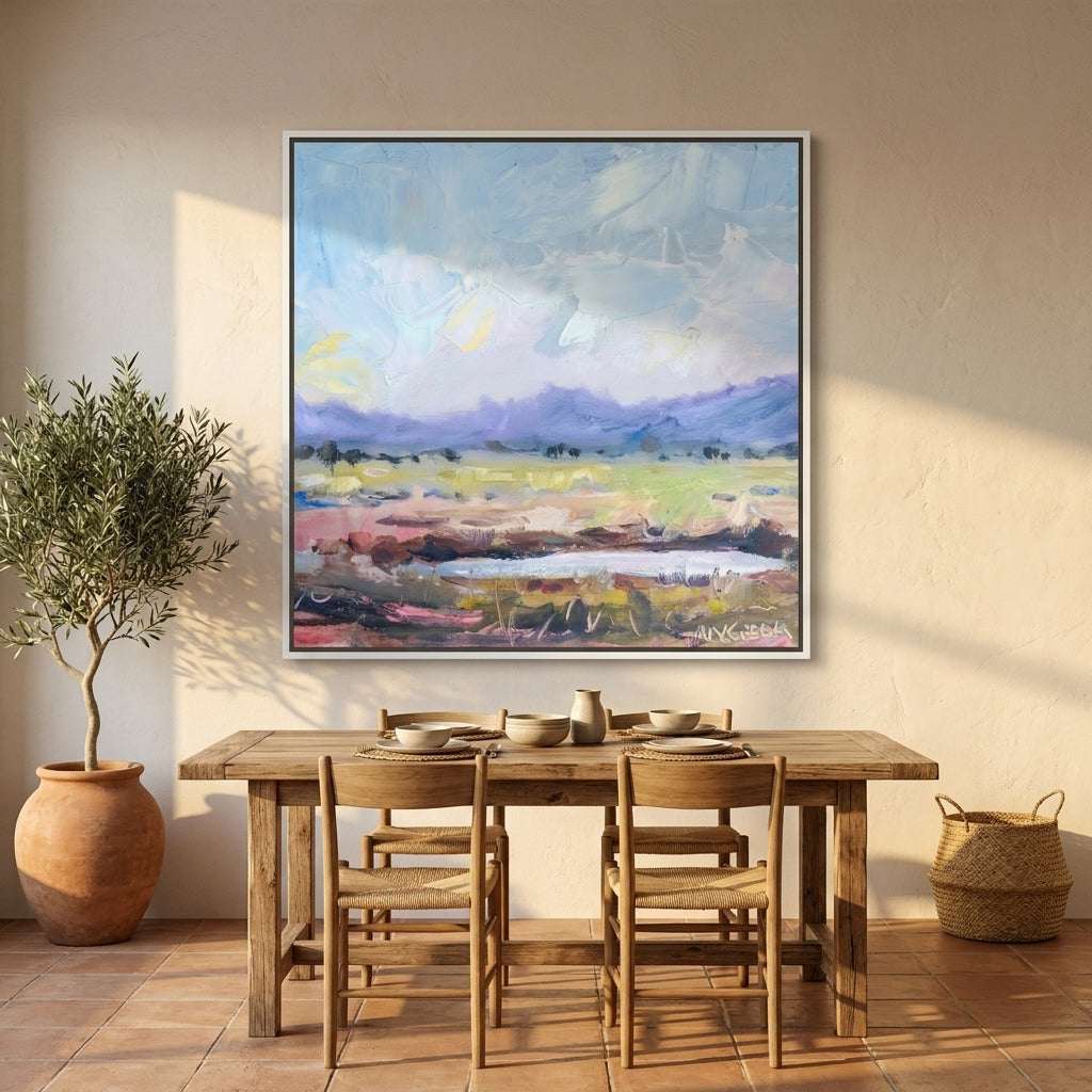 Oversized statement canvas wall art with a white surround styled on the wall in a Mediterranean dining room