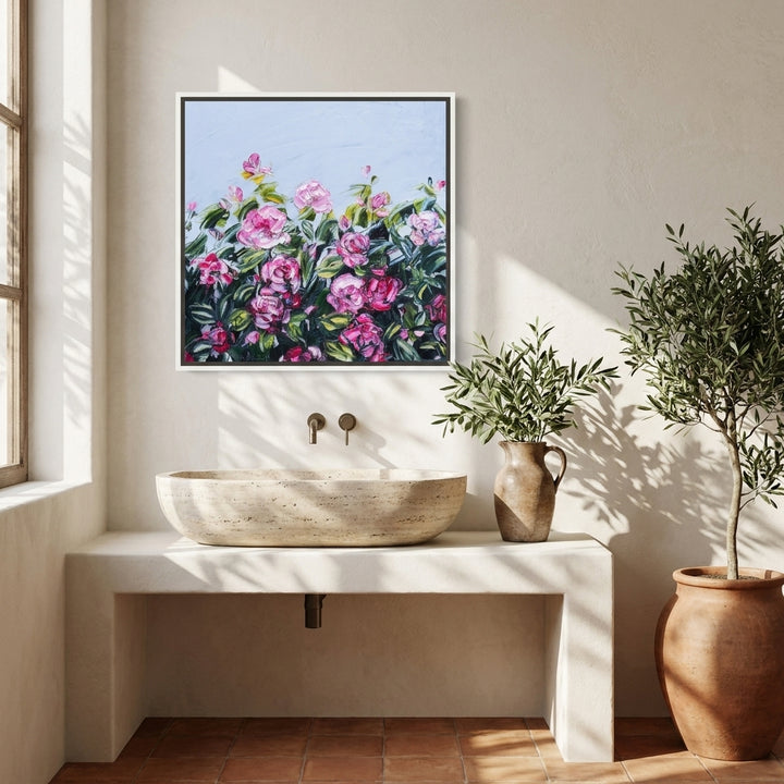 Canvas wall art with a white surround styled on the wall in a Mediterranean bathroom